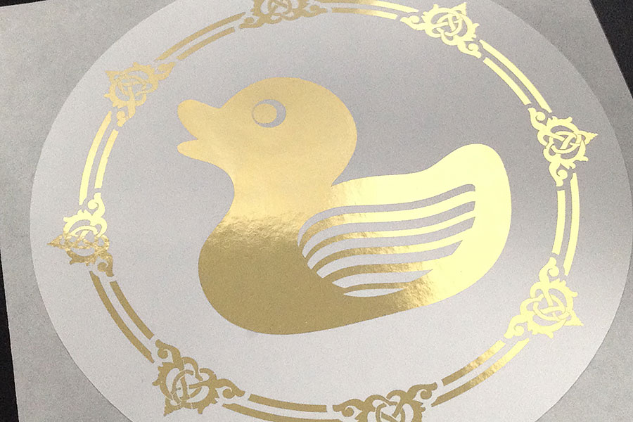Metallic-gold-duck-on-white-paper-sticker-label
